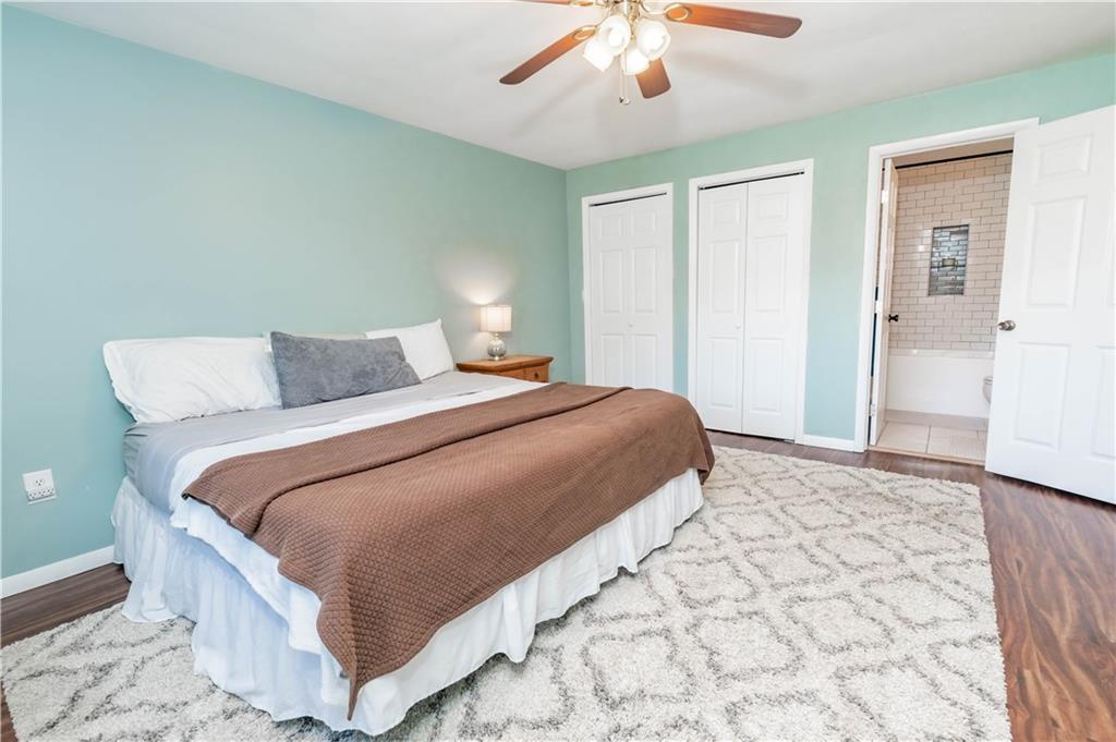 2555 Morrow Road Home, PA 15747 - Photo 9 of 24 a bedroom with a bed and a chandelier