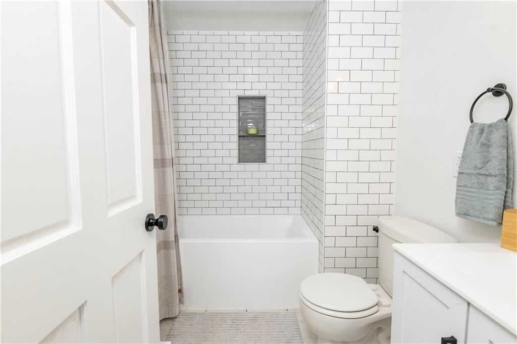 2555 Morrow Road Home, PA 15747 - Photo 10 of 24 a bathroom with a toilet a sink and shower