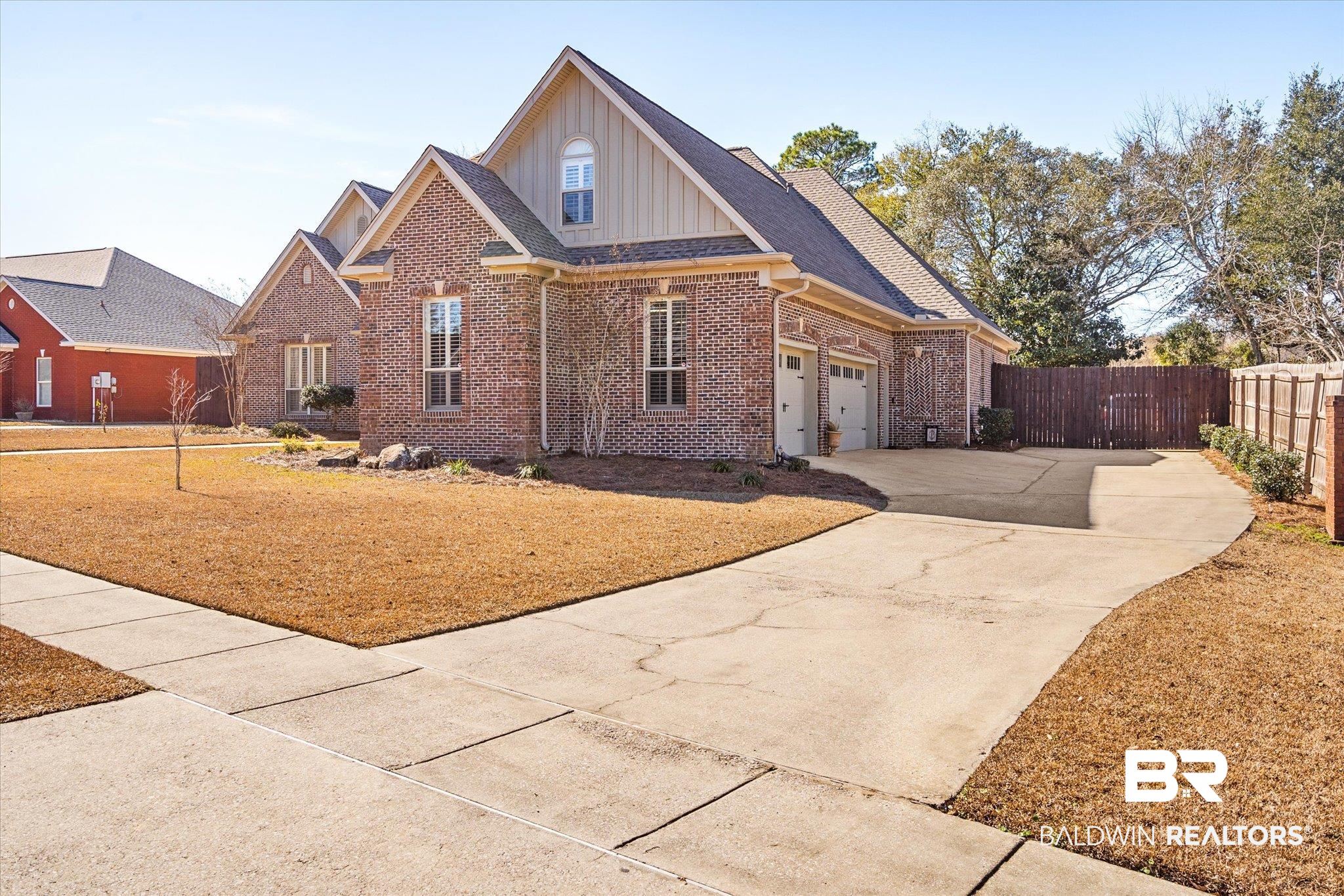 5683 Spring Landing Drive Theodore, AL 36582 - Photo 33 of 49 View of front of home with a front yard and a garage