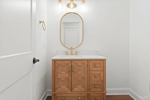 a bathroom with a double vanity sink mirror and toilet