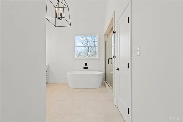 a bathroom with a double vanity sink a toilet and a shower