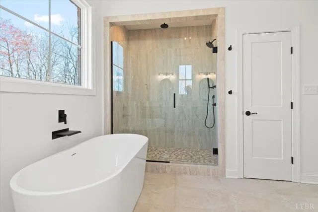 a front view of a house with a garden and plants