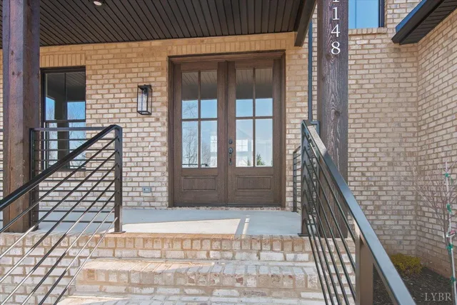 a kitchen with stainless steel appliances granite countertop a sink cabinets and wooden floor