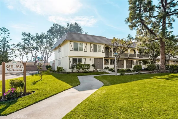 a view of a house with swimming pool and sitting area