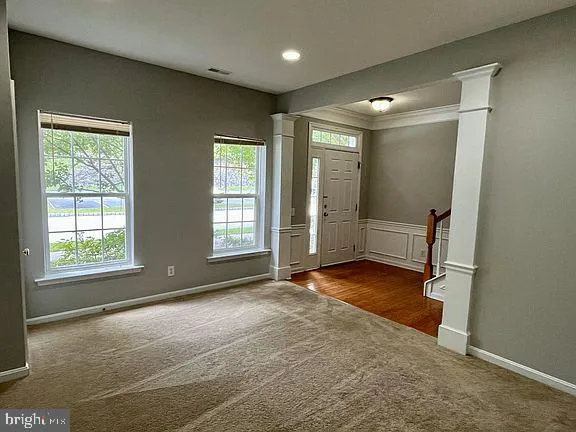 a view of an empty room with a window