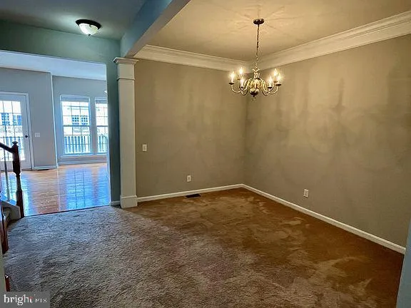 an empty room with a empty space and a ceiling fan