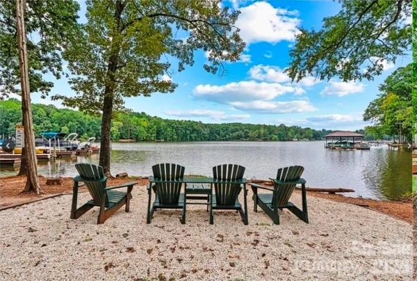 a couple of chairs and a table in a lake