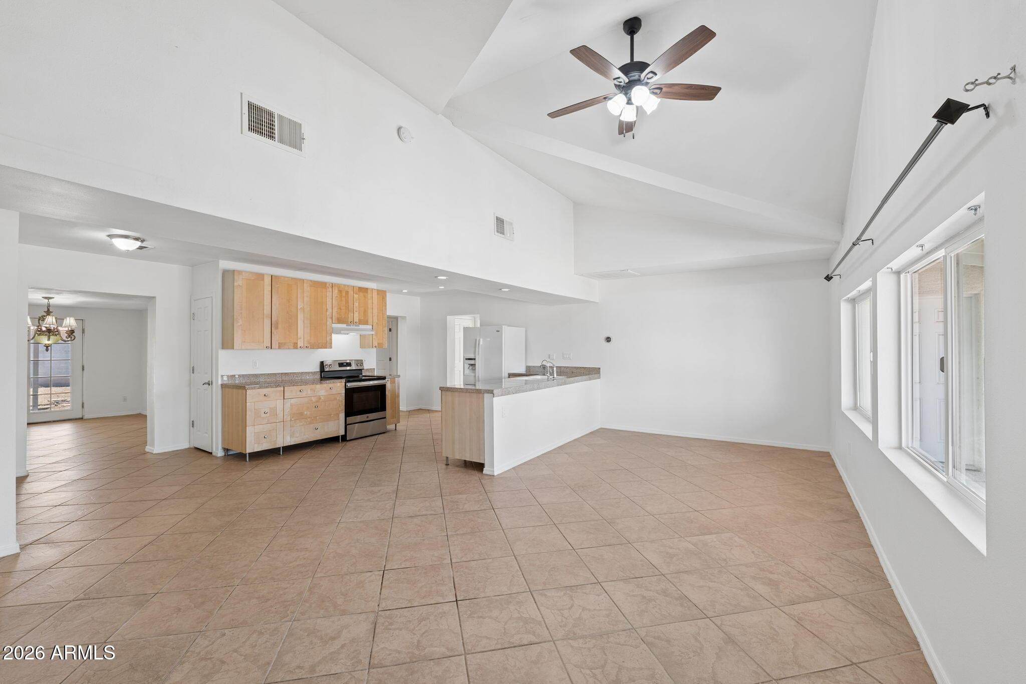 7 South Catalina Street Gilbert, AZ 85233 - Photo 5 of 34 a view of an empty room with a kitchen