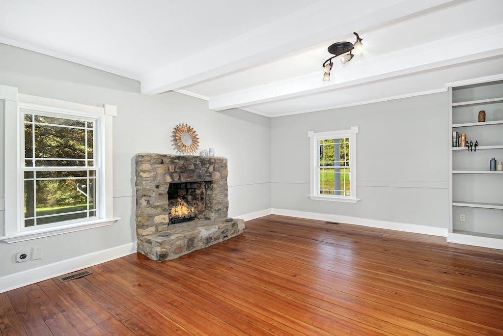 4610 Hall Road Rougemont, NC 27503 - Photo 16 of 44 a living room with furniture and a fireplace