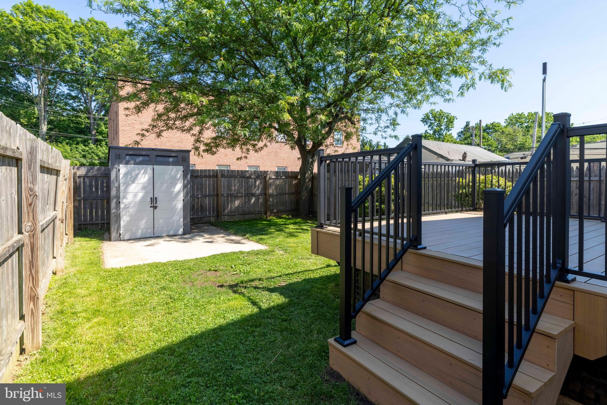 229 Wayne Avenue Narberth, PA 19072 - Photo 33 of 35 a view of a house with backyard and wooden fence