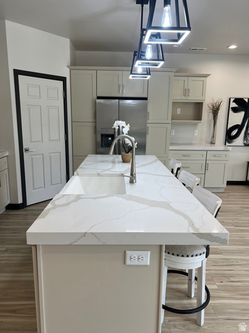 160 200 West Henefer, UT 84033 - Photo 5 of 25 Kitchen island featuring a white countertop with grey veining and an integrated sink