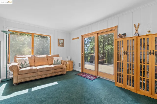 a view of a livingroom with furniture and windows