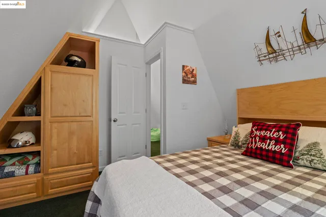 a bathroom with a granite countertop sink a toilet a shower and a mirror