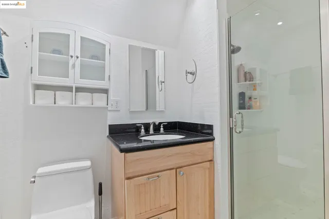 a room with a chair and a potted plant