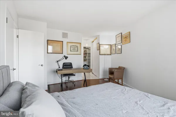 a living room with furniture and a chair