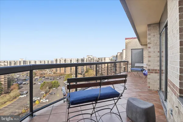 a view of a balcony with chairs
