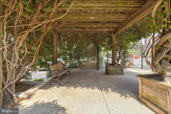 a view of a patio with table and chairs and potted plants
