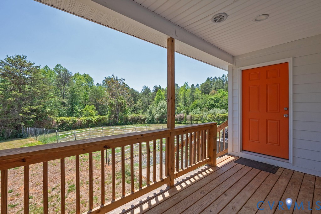 4336 Hells Bend Road Palmyra, VA 22963 - Photo 30 of 35 Covered wooden porch featuring an orange entry doo