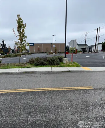 a view of a building and car parked