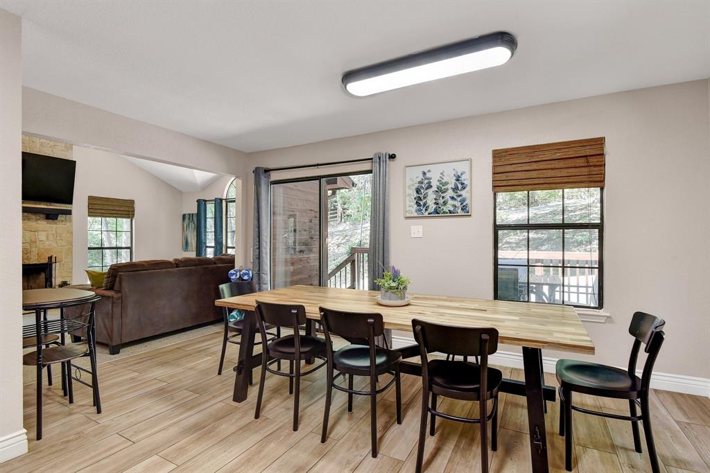 766 Lakepoint Loop Pottsboro, TX 75076 - Photo 11 of 33 a view of a dining room with furniture and wooden floor