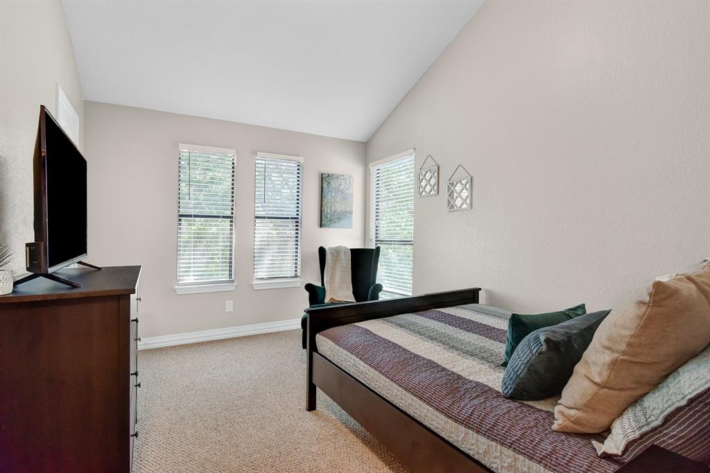 766 Lakepoint Loop Pottsboro, TX 75076 - Photo 15 of 33 a living room with furniture a flat screen tv and a window