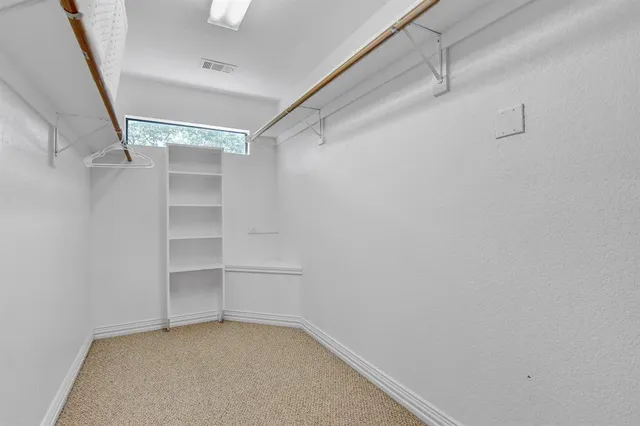 a view of an empty walk in closet