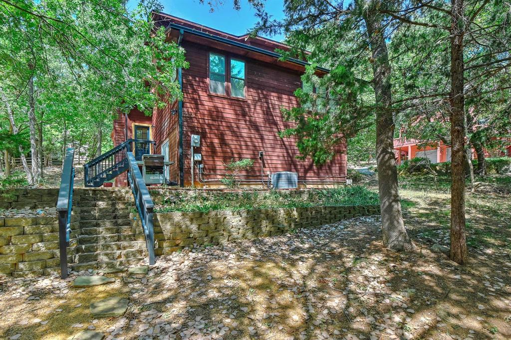 766 Lakepoint Loop Pottsboro, TX 75076 - Photo 30 of 33 a view of a house with brick walls