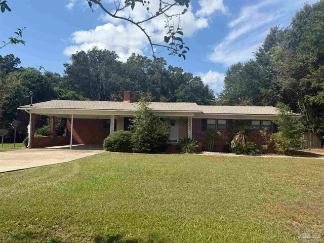front view of a house with a yard