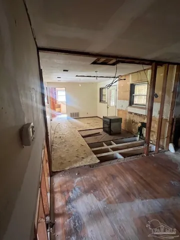 a view of a livingroom with furniture and windows