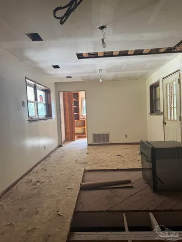 a view of a hallway with a glass door