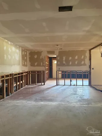 a view of a big room with a large window