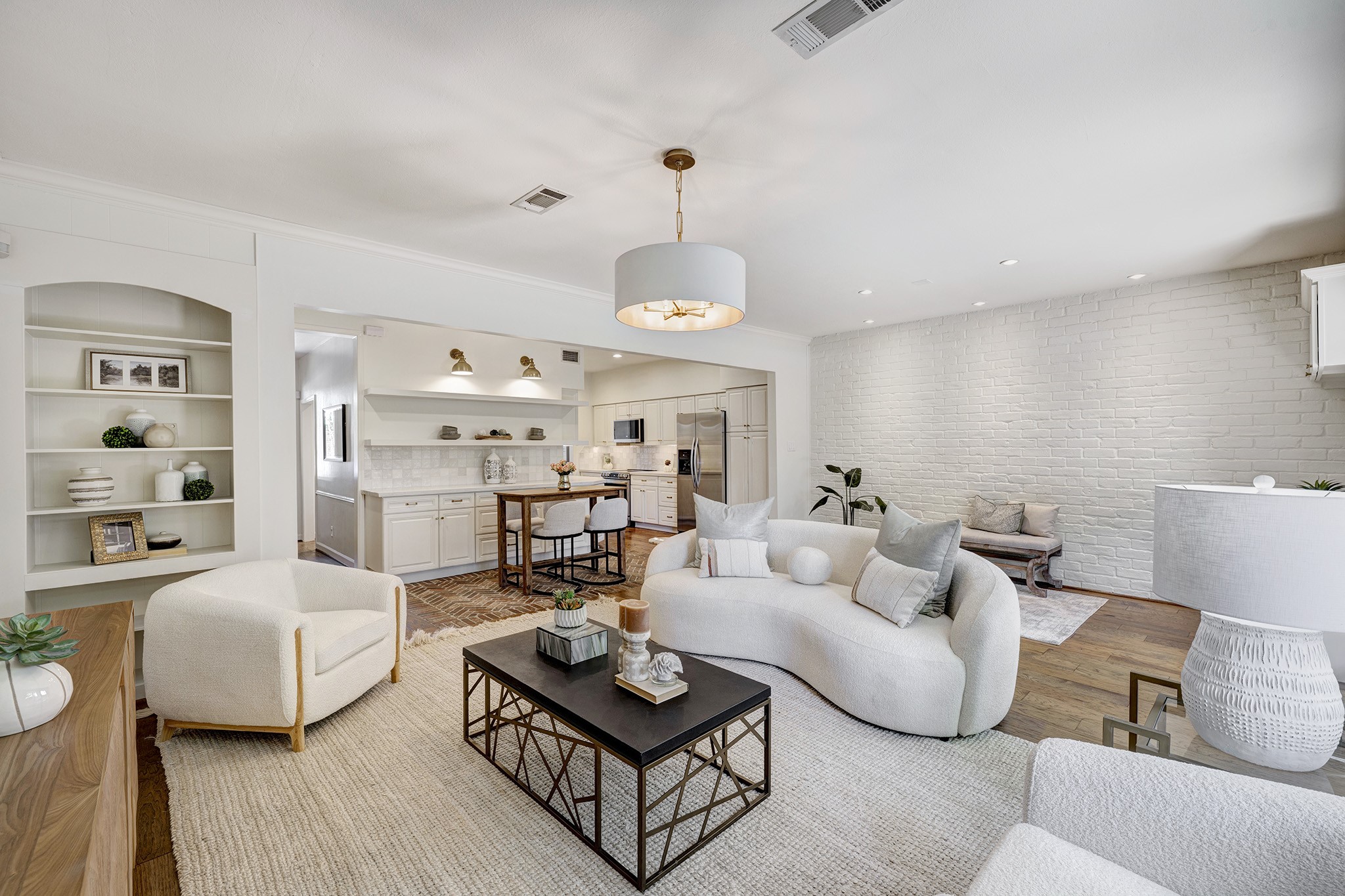 a living room with furniture a rug and a chandelier
