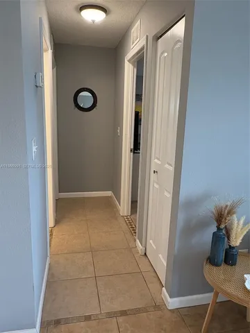 a bed room with a bed and a chair