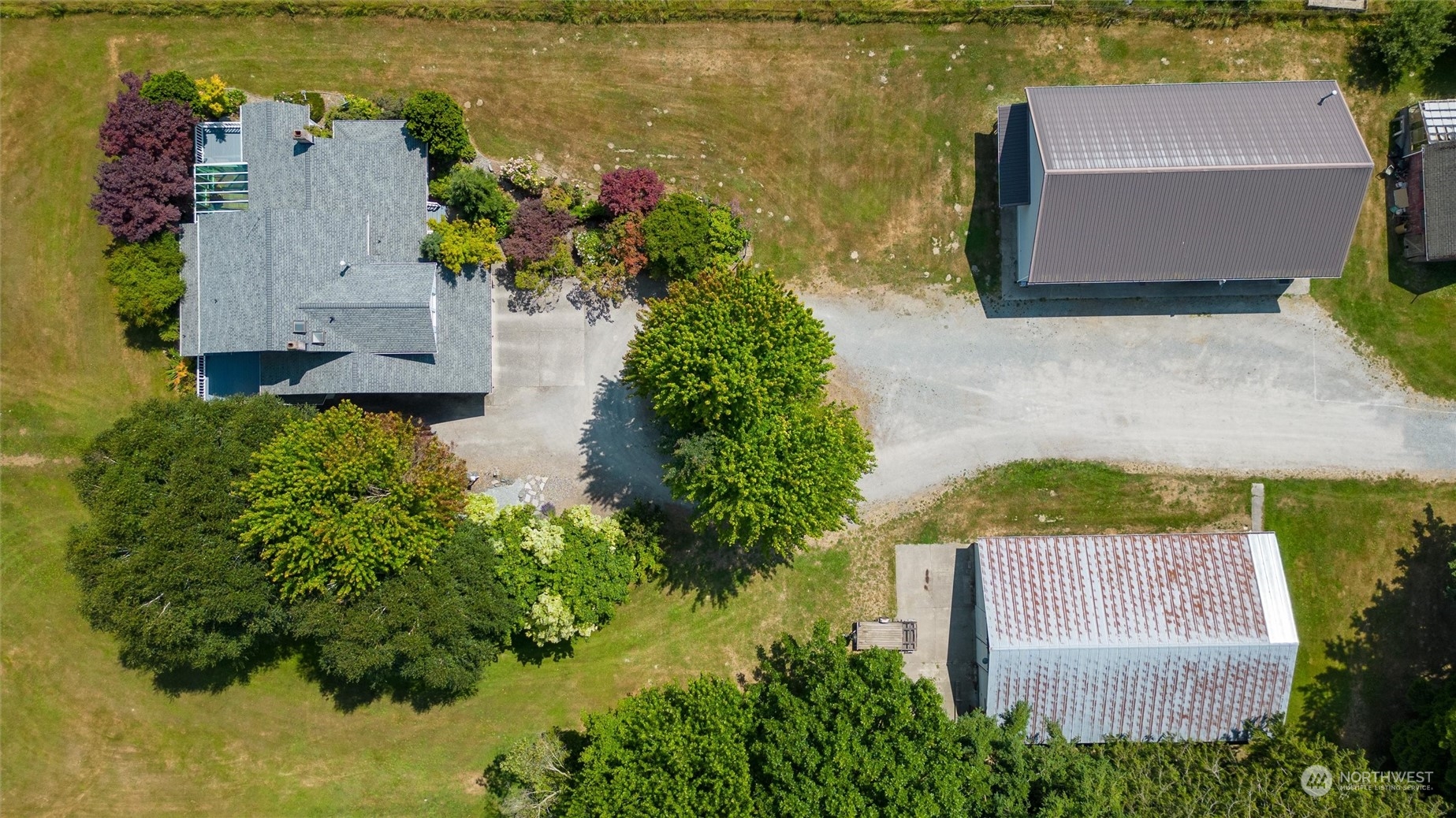 13595 Avon Allen Road Mount Vernon, WA 98273 - Photo 3 of 37 an aerial view of a house with a yard and lake view