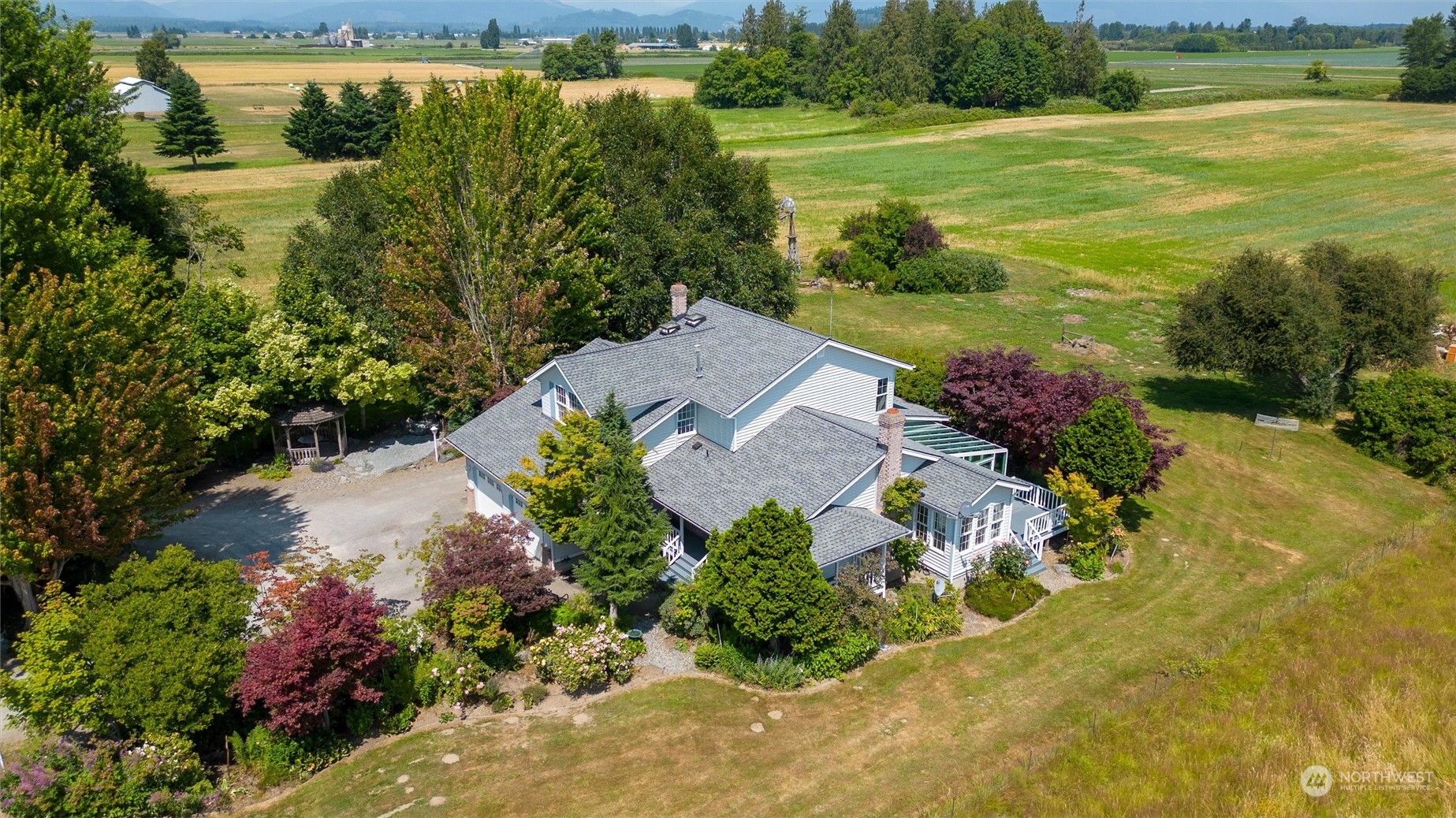 13595 Avon Allen Road Mount Vernon, WA 98273 - Photo 33 of 37 a view of a lake with a yard