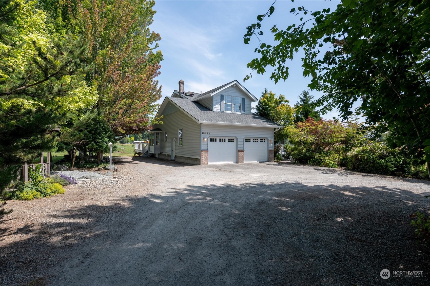 13595 Avon Allen Road Mount Vernon, WA 98273 - Photo 5 of 37 a front view of a house with a yard and garage