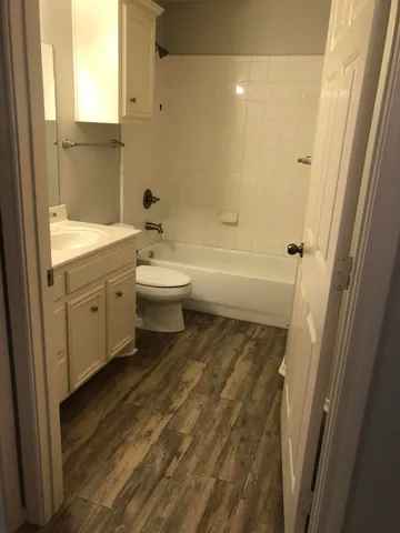 a bathroom with a sink a toilet and a bathtub