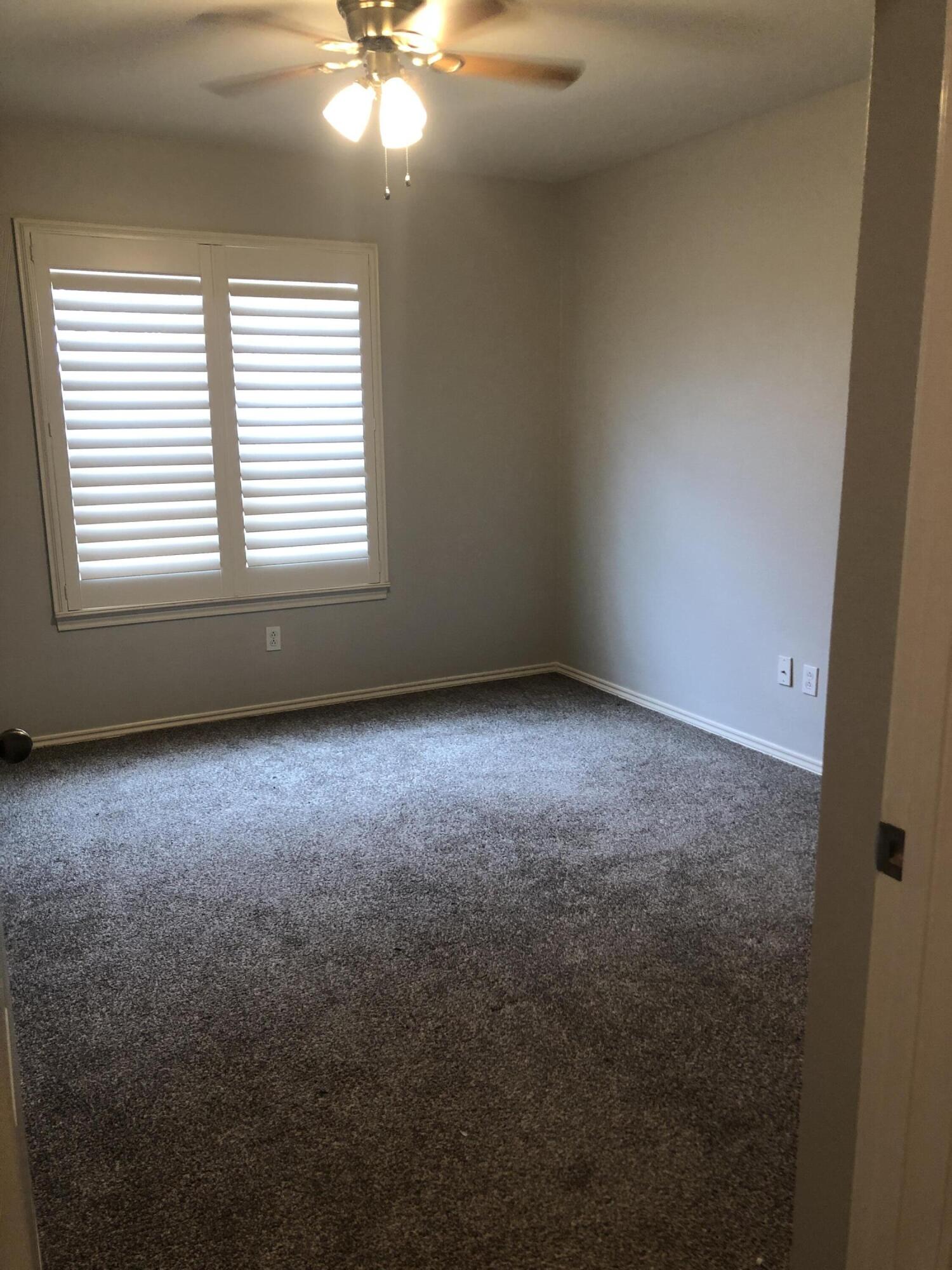 7528 84th Street Lubbock, TX 79424 - Photo 12 of 20 an empty room with a window