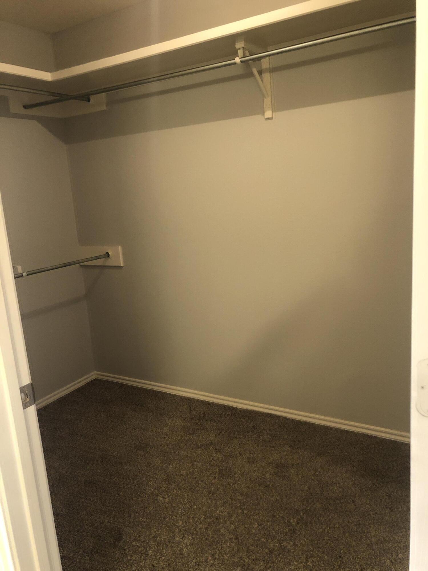 7528 84th Street Lubbock, TX 79424 - Photo 13 of 20 a view of a room with racks on the wall