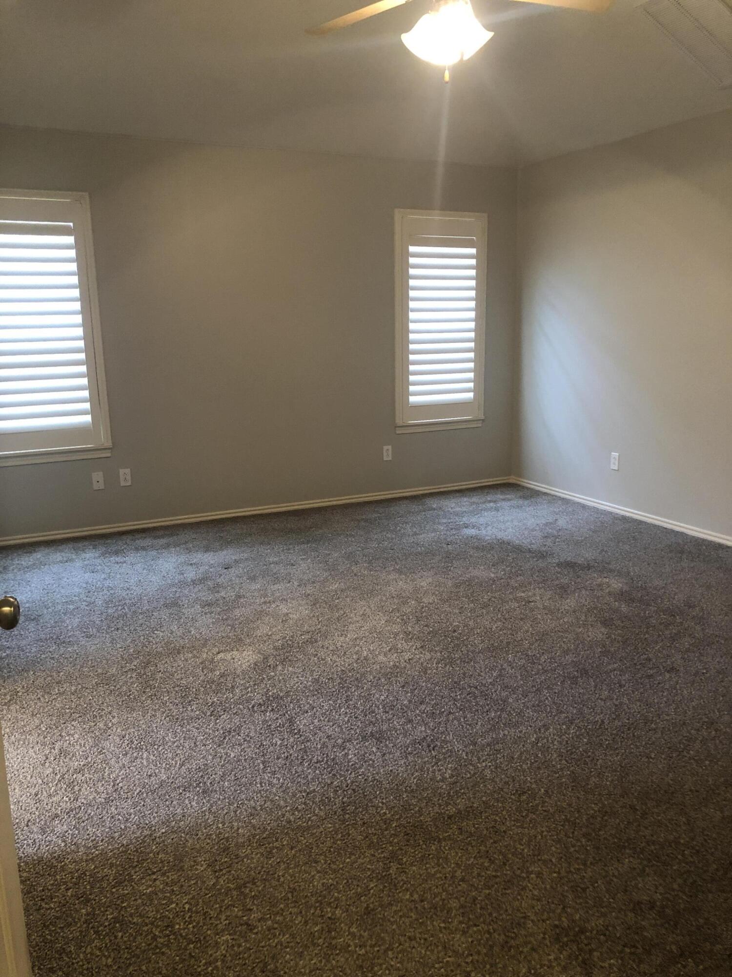 7528 84th Street Lubbock, TX 79424 - Photo 14 of 20 a view of an empty room with a window