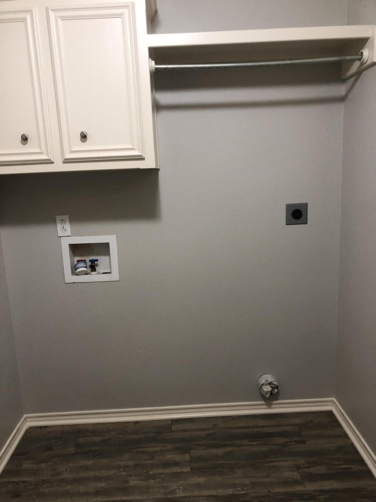 7528 84th Street Lubbock, TX 79424 - Photo 17 of 20 a view of an empty room with wooden floor