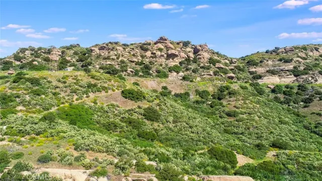 a view of a large building with a mountain in the background