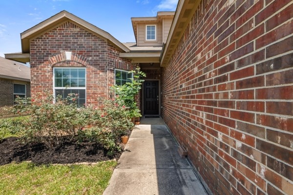 1327 Diamond Drape Drive Rosharon, TX 77583 - Photo 2 of 26 a view of a brick house with a large windows