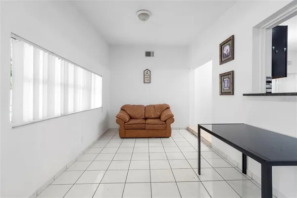a living room with furniture and a window
