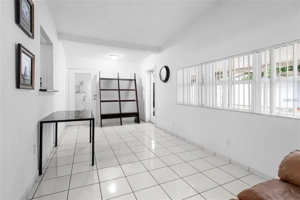 a view of a livingroom with wooden floor and cabinet