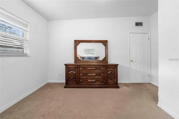 a view of room with furniture and closet