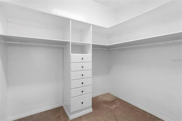a view of an empty walk in closet