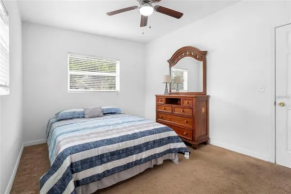 a bedroom with a bed and a dresser