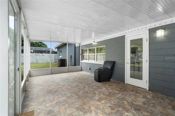 a view of a backyard with seating space