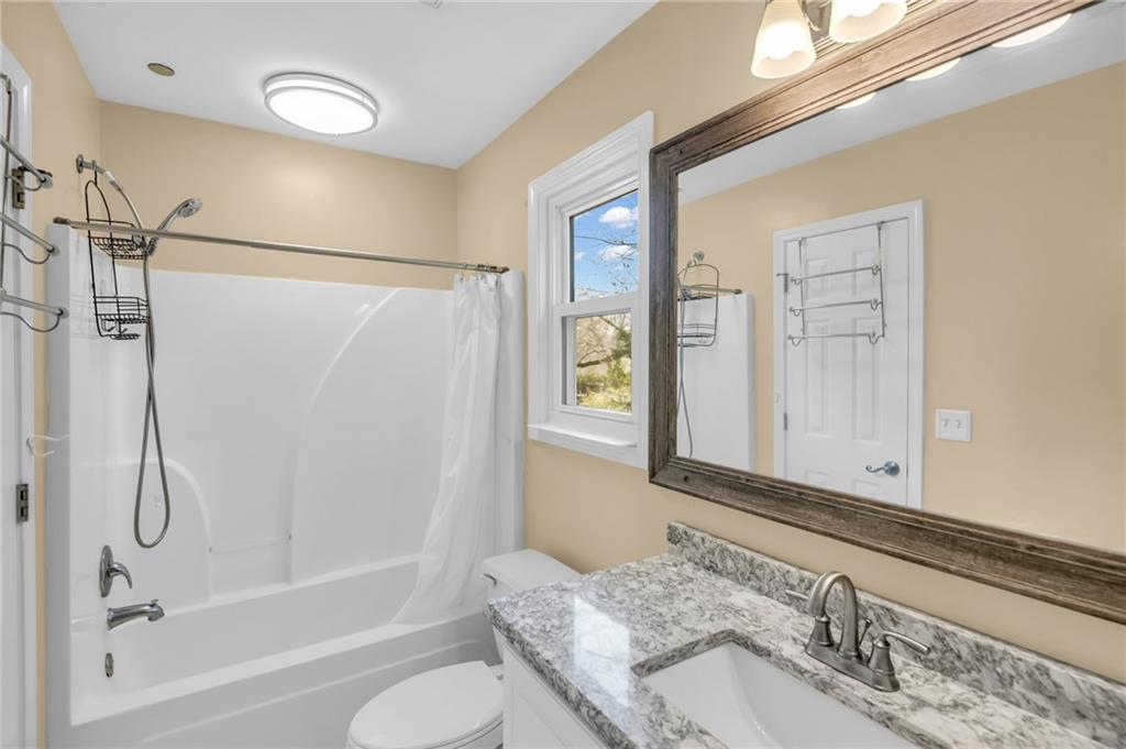 1093 3rd Street Stone Mountain, GA 30083 - Photo 22 of 43 a bathroom with a granite countertop sink toilet and shower